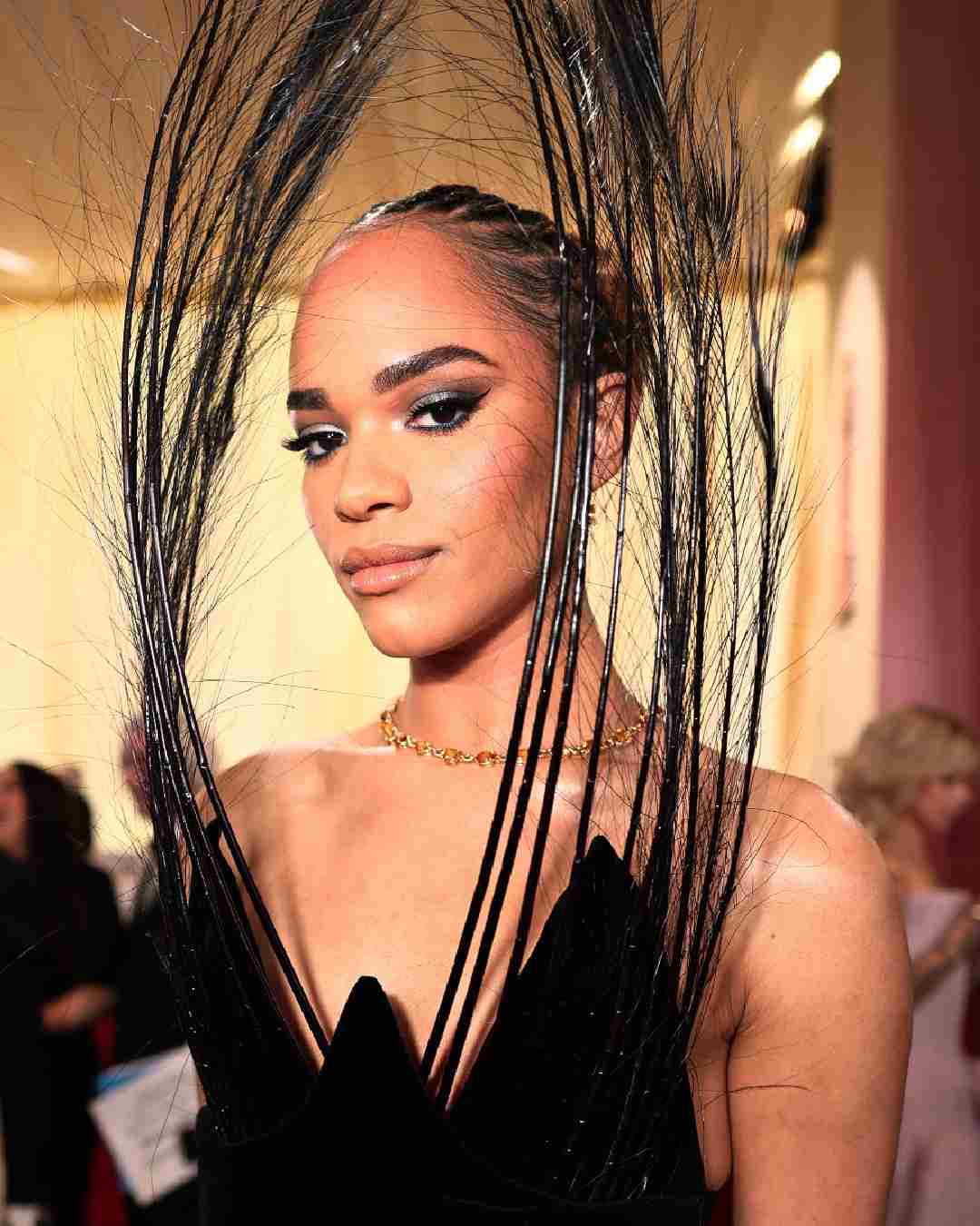 Heartstopper actress Yasmin Finney stunned in a chic black feather dress. Smokey eyes, a golden chain and nude lips rounded off her look for the ceremony.  