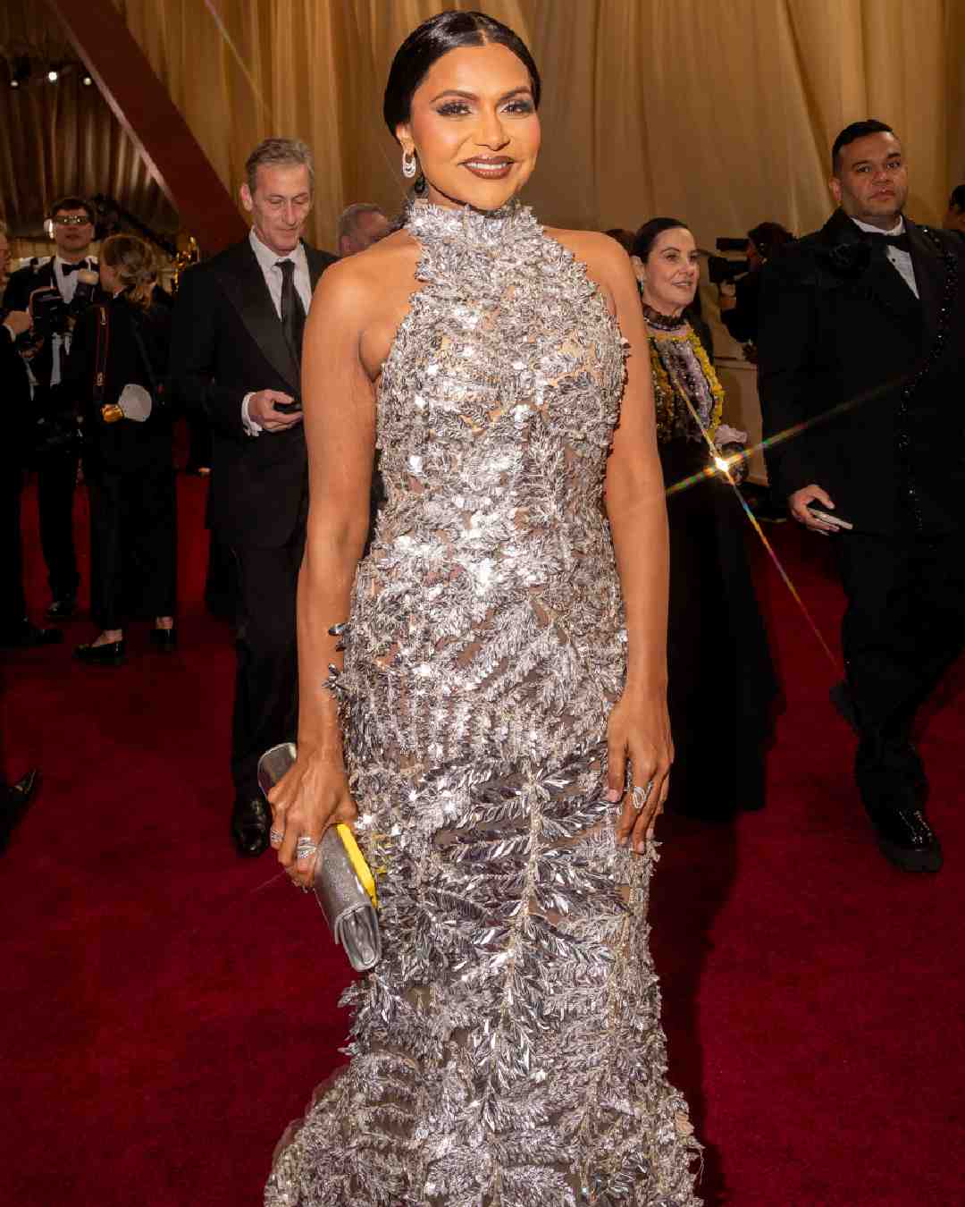 Actress-producer Mindy Kaling, who recently received a star on the Hollywood Walk of Fame, wore a sequined silver gown with leafy motifs.