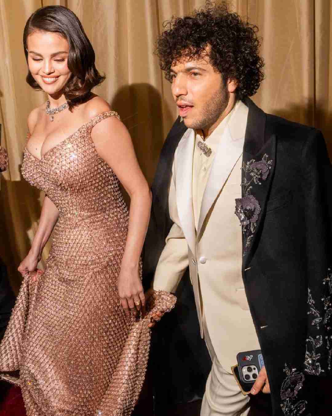 Selena Gomez dazzled in a shimmery champagne-hued Ralph Lauren gown. The Emilia Perez actress attended the awards ceremony with fiance Benny Blanco. 