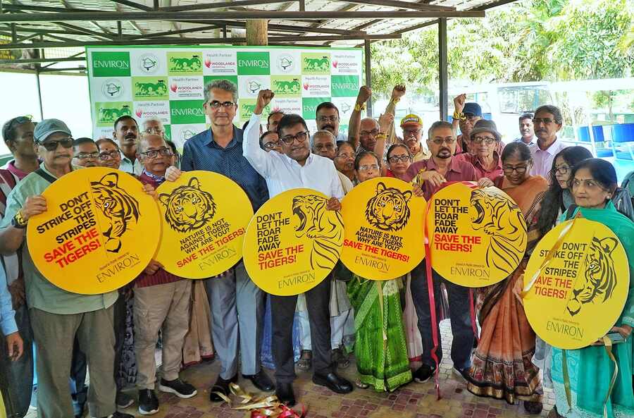 Biswajit Roy Chowdhury, secretary, Nature Environment & Wildlife Society, and Shiladitya Chaudhury, wildlife photographer & governing body member, Nature Environment & Wildlife Society, launch an awareness campaign, ‘Save the Tiger’ on World Wildlife Day at Alipore Zoological Garden. Members of PRONAM, an outreach initiative by Kolkata Police for senior citizens, were present at the event on Monday  