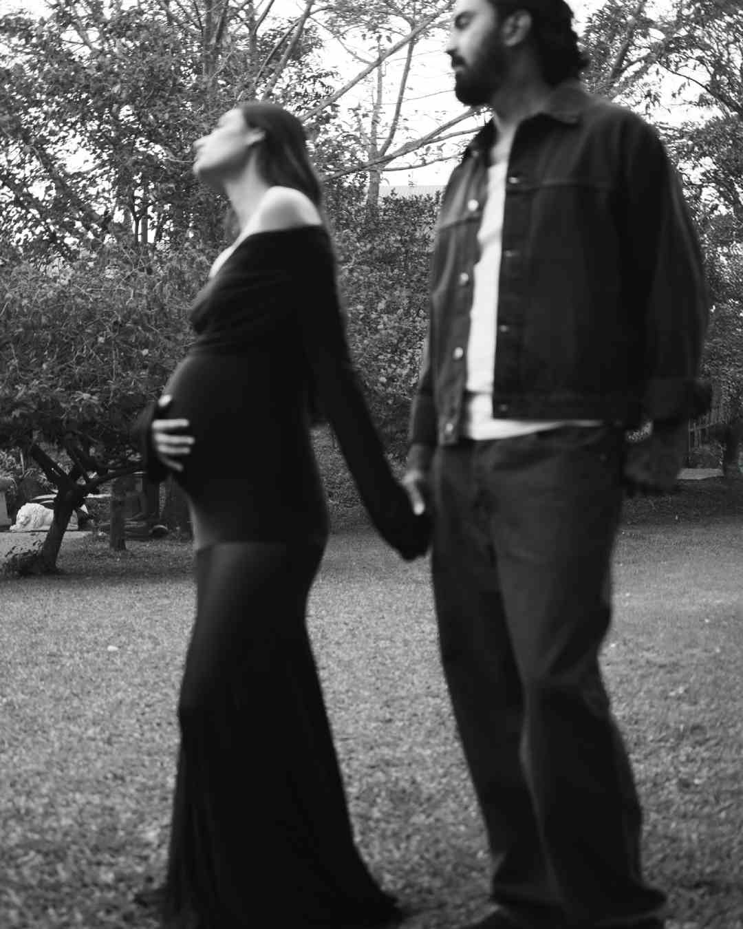 Dressed in monochrome outfits, Athiya and KL Rahul held hands while strolling through a sprawling garden. 