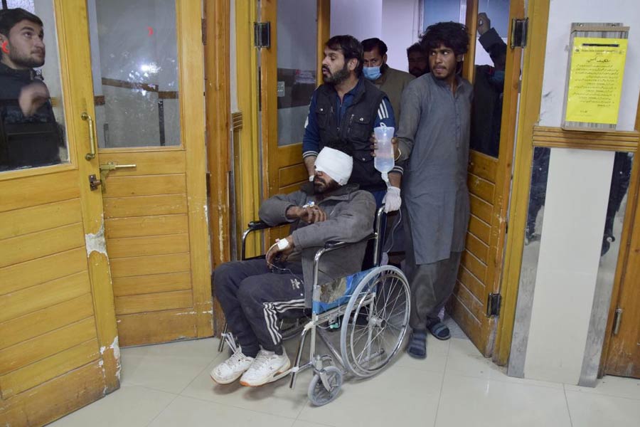 An injured victim of a passenger train attacked by insurgents, shifts to another ward after receiving initial treatment at a hospital in Quetta, Pakistan's southwestern Balochistan province, Thursday March 13, 2025.