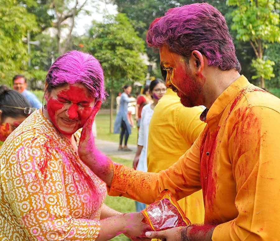 Revellers dressed in yellow, the colour of ‘Basanta’, smeared colours on each other