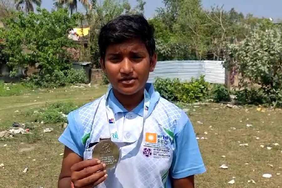 Mishti Karmakar with the gold medal that she won at the national youth Olympics.
