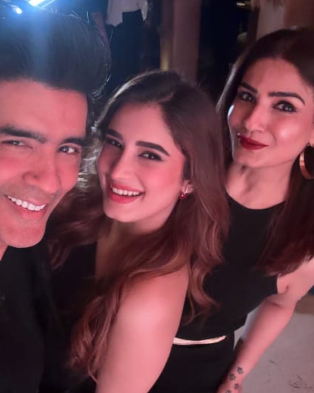 Rasha Thadani, who recently made her acting debut with Azaad, posed for a selfie with Manish and mother Raveena. The trio sported matching black outfits at the event. 