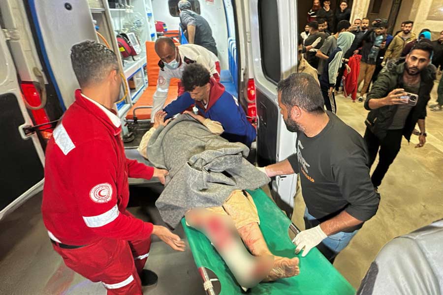 A Palestinian casualty is brought to Nasser hospital following Israeli strikes, in Khan Younis in the southern Gaza Strip.