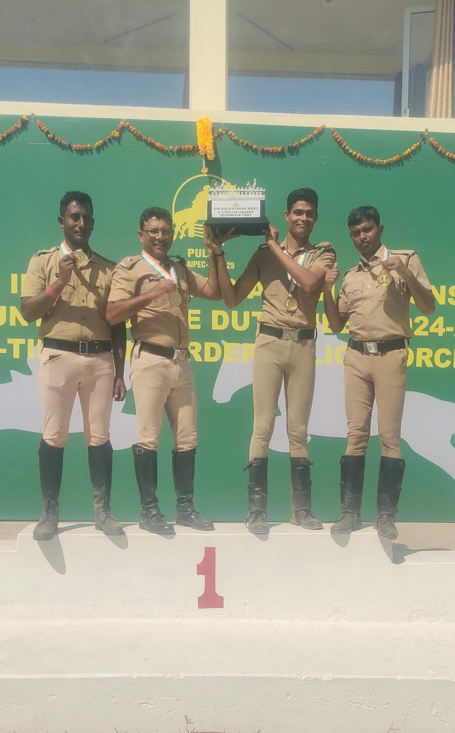 The champions lift the trophy