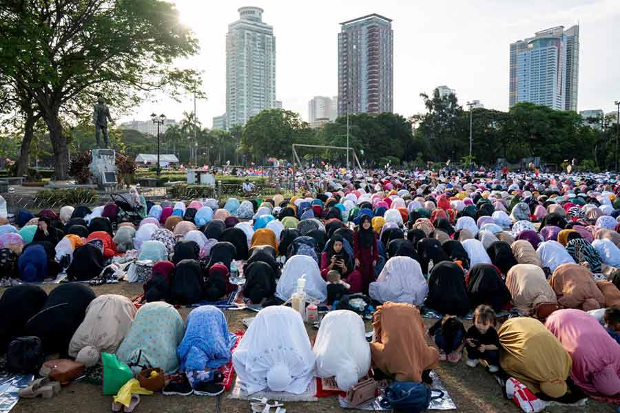 Filipino Muslims attend Eid al-Fitr prayers to mark the end of the holy month of Ramadan at Quirino Grandstand, in Manila, Philippines.