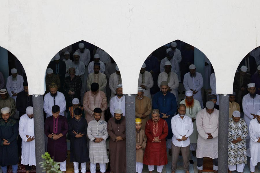 Bangladeshi Muslims attend Eid al-Fitr prayers to mark the end of the holy month of Ramadan, at Baitul Mukarram National Mosque, in Dhaka, Bangladesh.