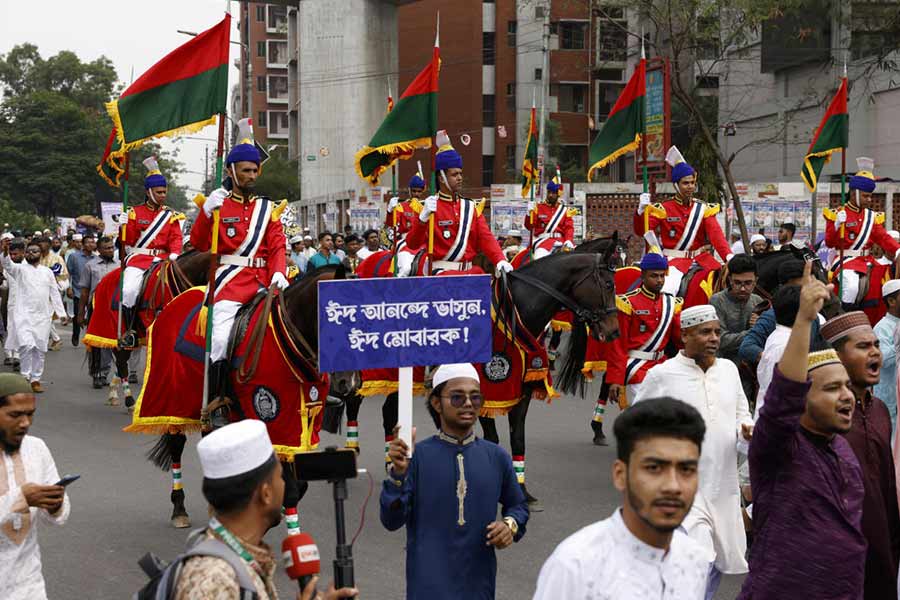 Police officers ride horses in an Eid al-Fitr rally as people celebrate to mark the end of the holy month of Ramadan, in Dhaka.