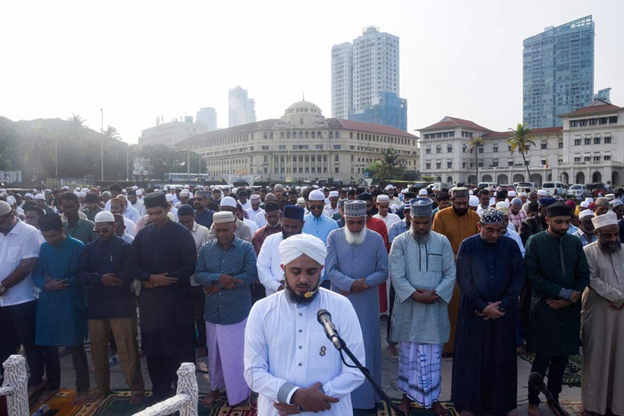 An imam leads Eid al-Fitr prayers at Galle face in Colombo, Sri Lanka.