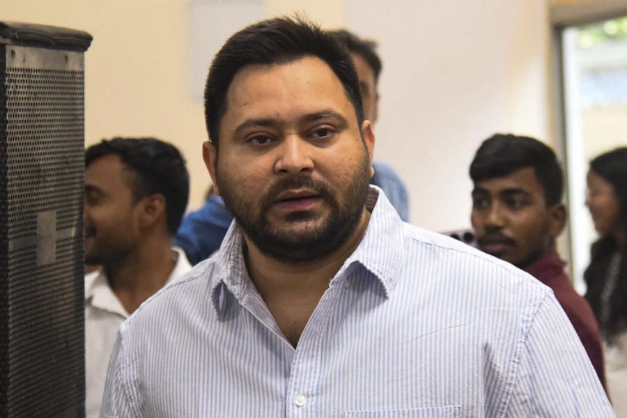 Tejashwi Yadav (left), Prime Minister Narendra Modi