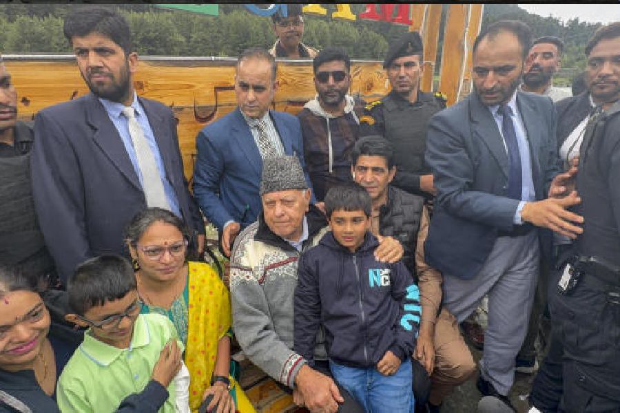 Farooq Abdullah interacts with tourists in Anantnag on Saturday