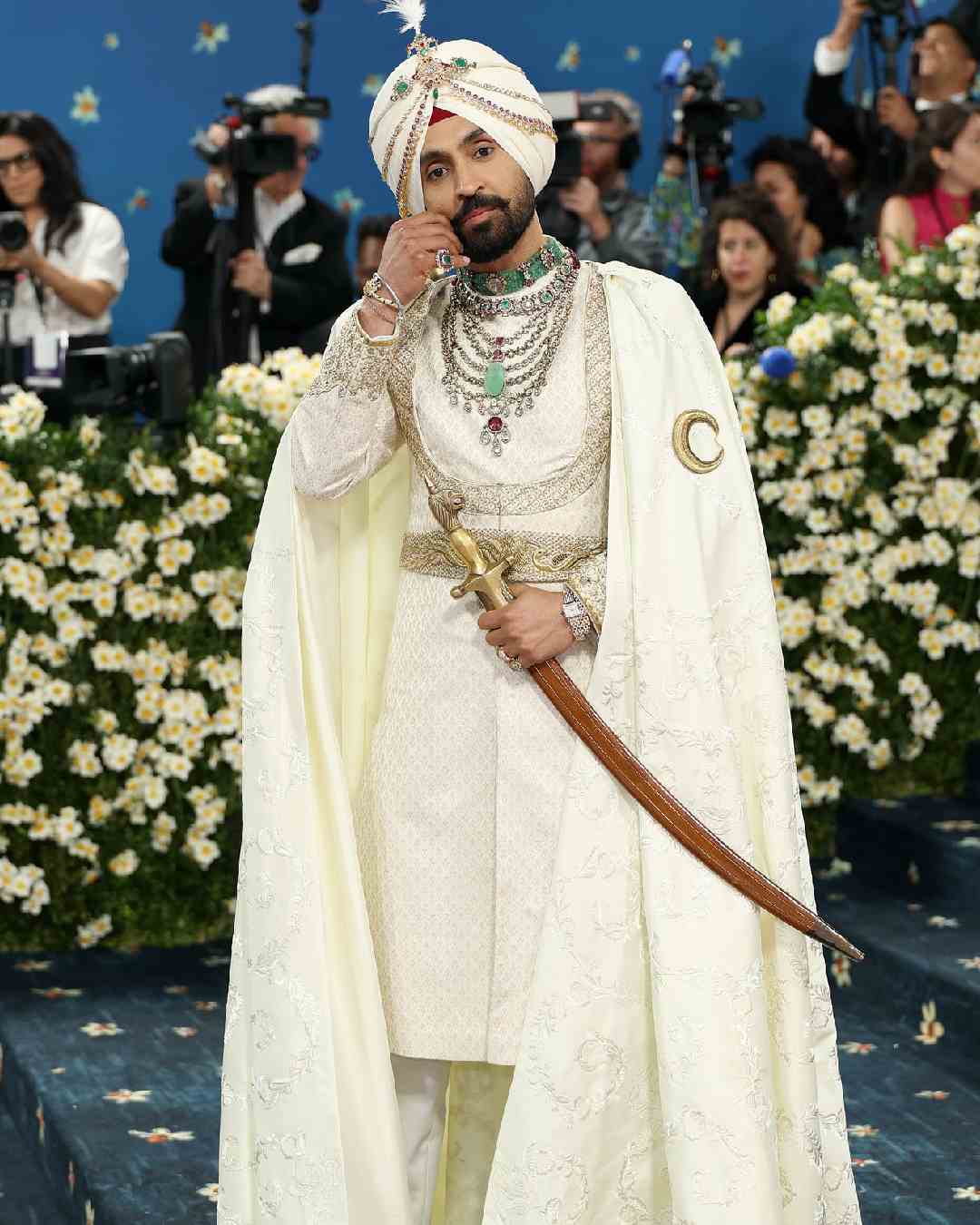 Singer Diljit Dosanjh embraced his Punjabi roots in an ivory-gold Prabal Gurung Maharaja suit.