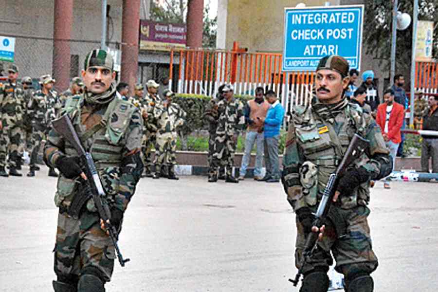Indian army soldiers patrol outside integrated check post at Attari.