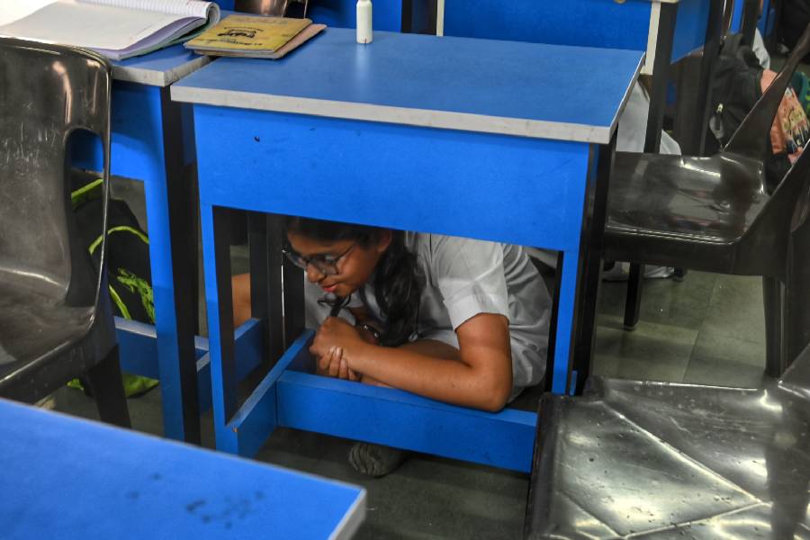 Students were also taught to take cover under a desk in case of an attack. 