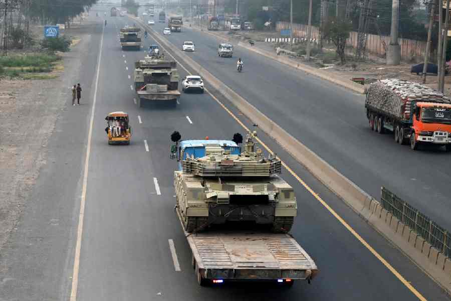 Tanks are transported on a road in Muridke near Lahore