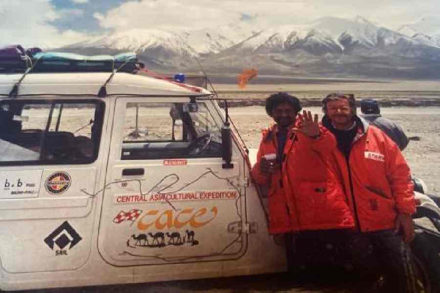Sergio Scapagnini and Goutam Ghose pose on the Silk Route with the expedition vehicle.