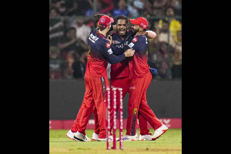 Royal Challengers Bengaluru's players celebrate after winning the Indian Premier League (IPL) 2025 cricket match against Chennai Super Kings, at M Chinnaswamy Stadium in Bengaluru