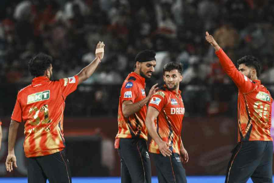Punjab Kings' bowler Azmatullah Omarzai celebrates with teammates after the wicket of Lucknow Super Giants' batter David Miller