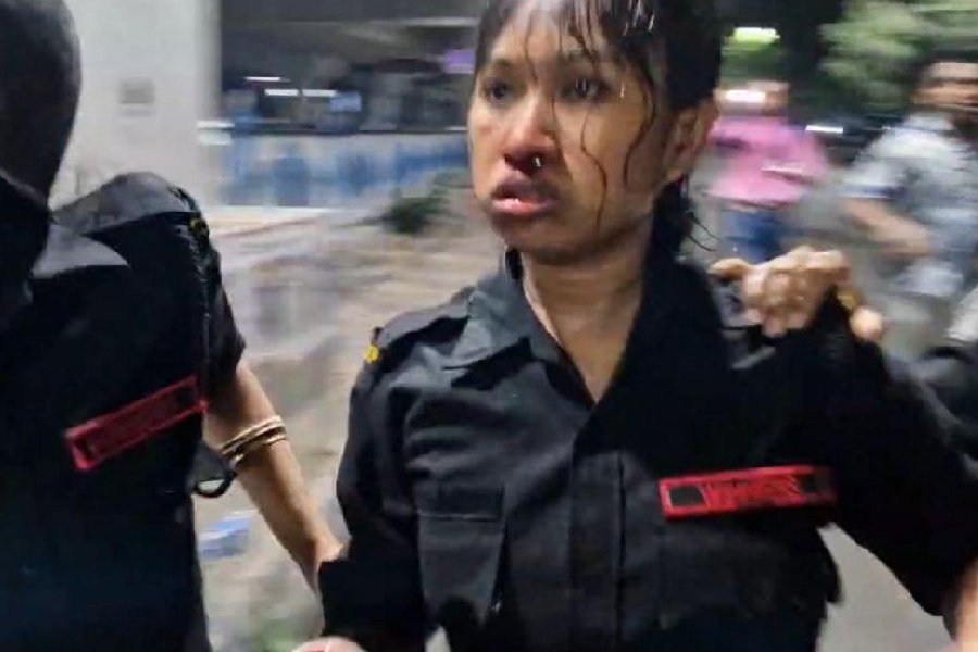 A distraught cop after being attacked by protesters