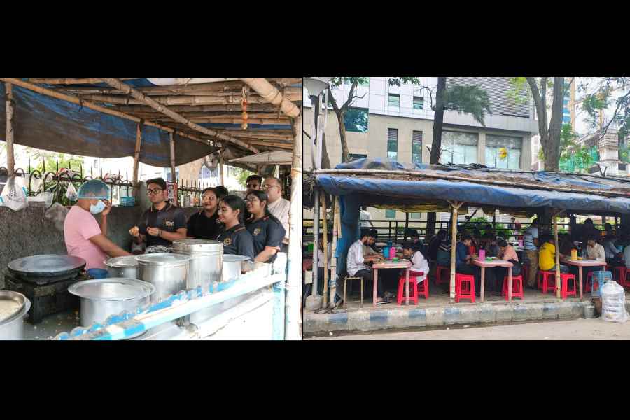 A hawker puts on a mask and cap while being counselled on food safety by students of Institute of Advance Education and Research in Sector V (Right) Office-goers at lunch on the streetside in Sector V on Tuesday