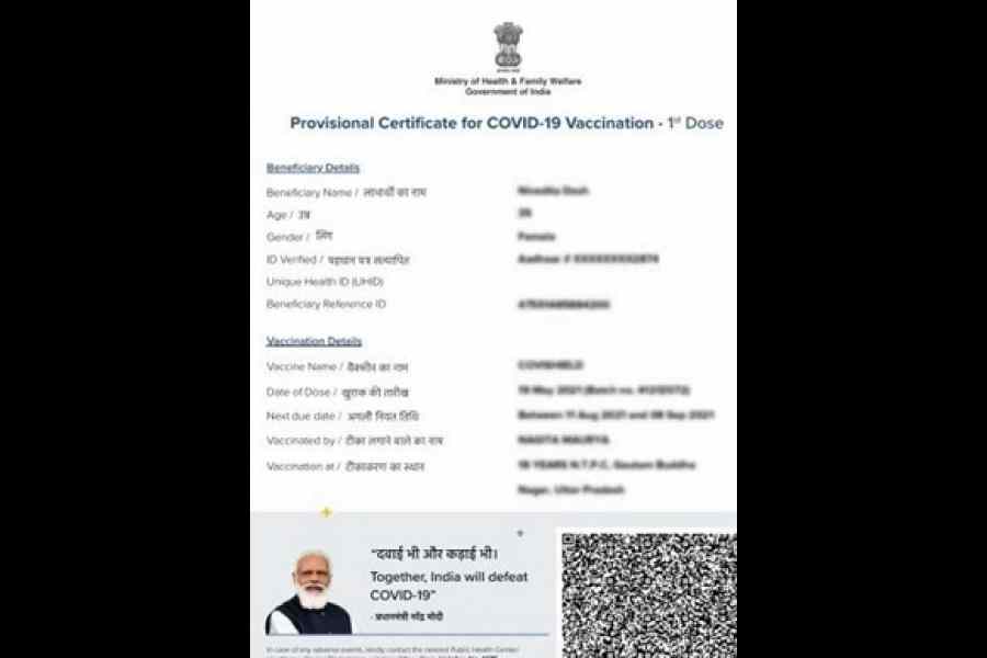 A Covid-19 vaccination certificate with Narendra Modi's picture on it