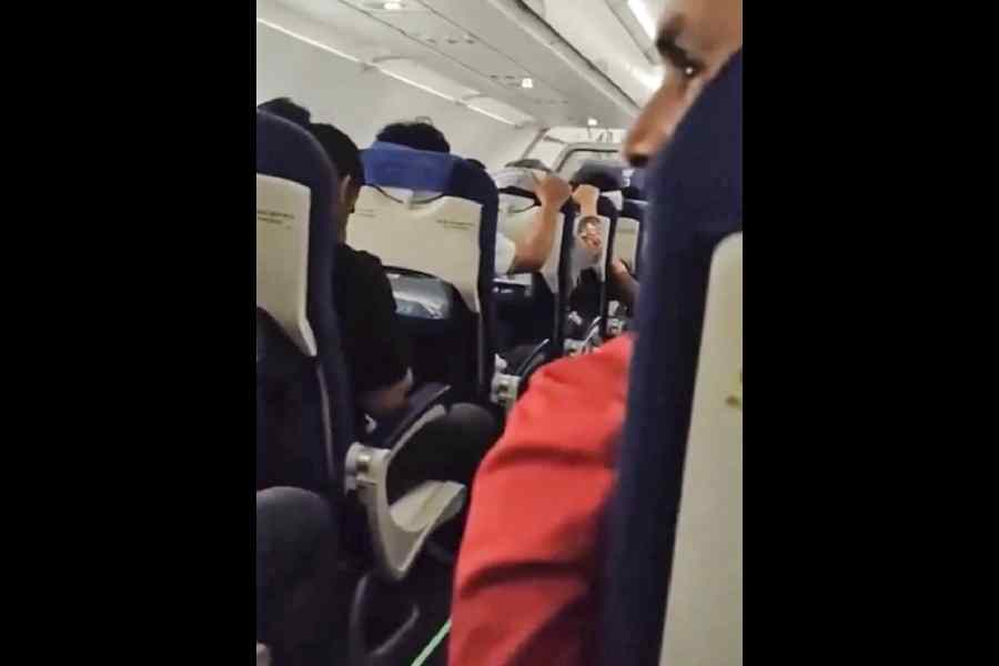 Passengers react after a Delhi–Srinagar IndiGo flight hit turbulence mid-air due to inclement weather, prompting the pilot to report the _emergency_ to air traffic control at Srinagar.