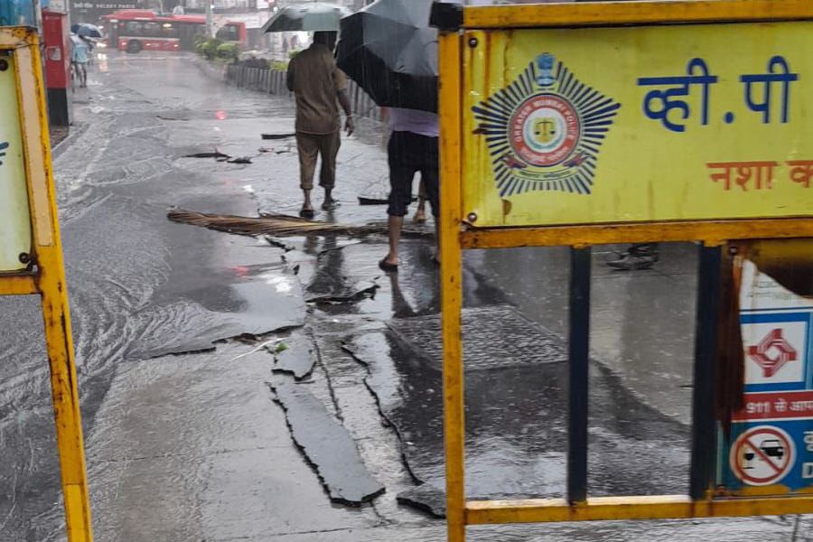 First day of rain of the early monsoon causes road collapse and disintegration at Kemps Corner in Mumbai
