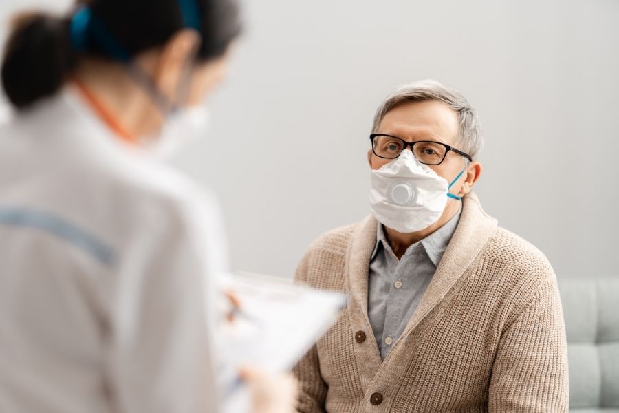 Anyone experiencing persistent flu-like symptoms, such as moderate to high fever, dry cough, sore throat, or loss of smell, should not ignore them