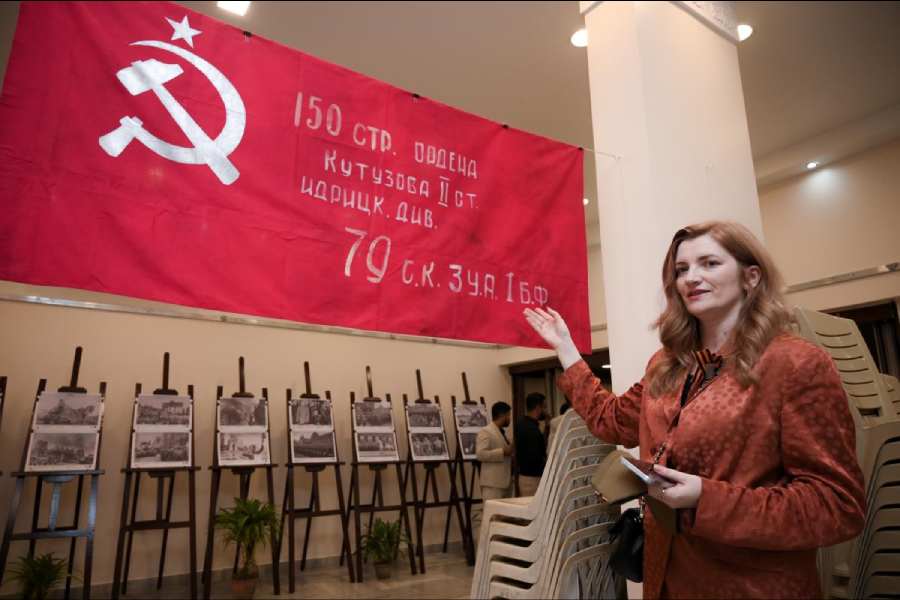 Irina Malysheva points to a replica of the historic banner that she had brought from Moscow