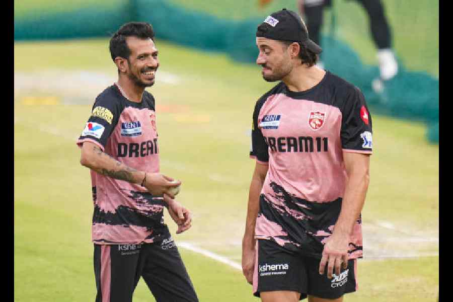 Punjab Kings’ Marcus Stoinis, right, and Yuzvendra Chahal during a practice session.
