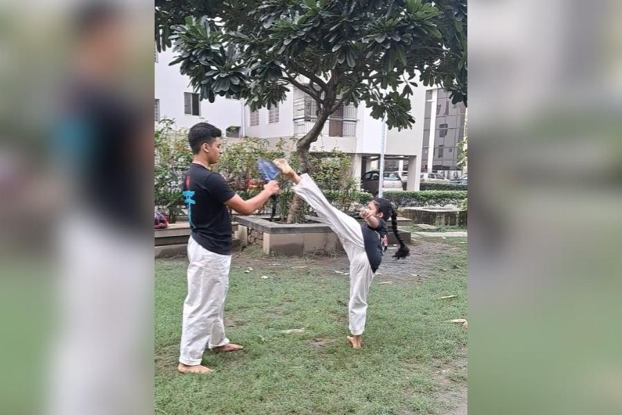 A girl undergoes karate training in a gated community in Kolkata