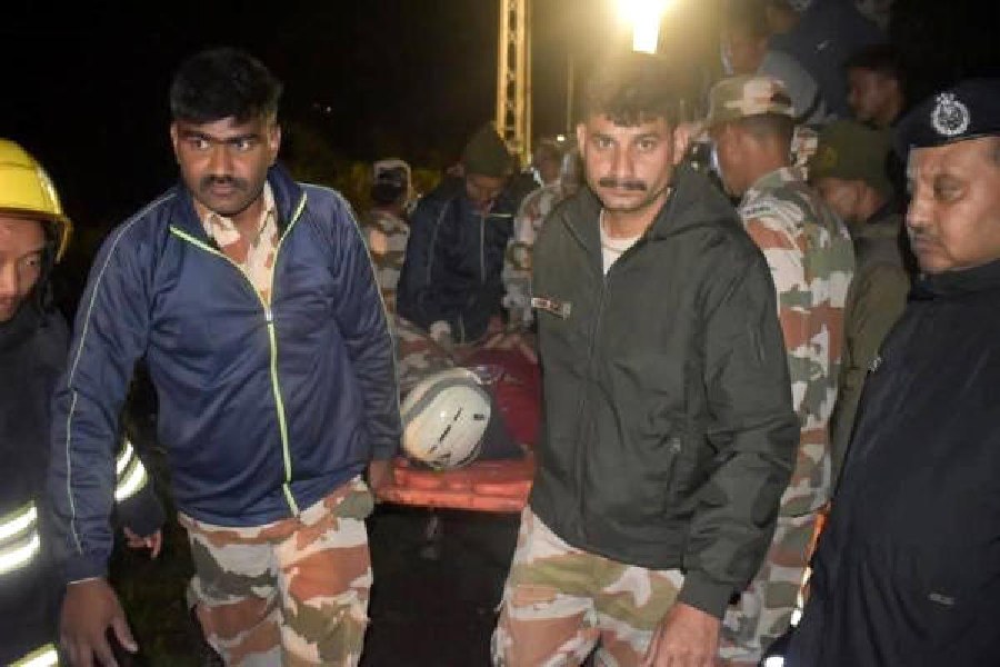Security personnel during the rescue operation after the SUV plunged into the Teesta on Thursday night