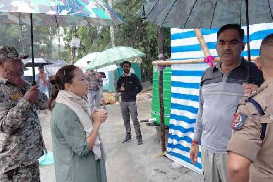 Shraddha Subba, the SDO of Dhupguri subdivision, visits a flood-hit area in Gadheyarkuthi in Jalpaiguri district on Friday. Picture by Biplab Basak