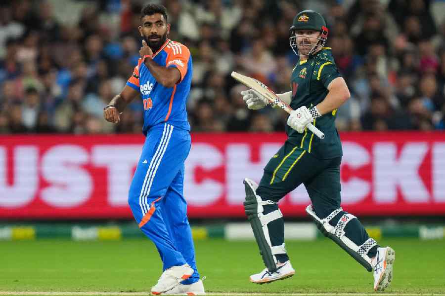 Jasprit Bumrah looks on as Travis Head takes a single during the second T20I on Friday.