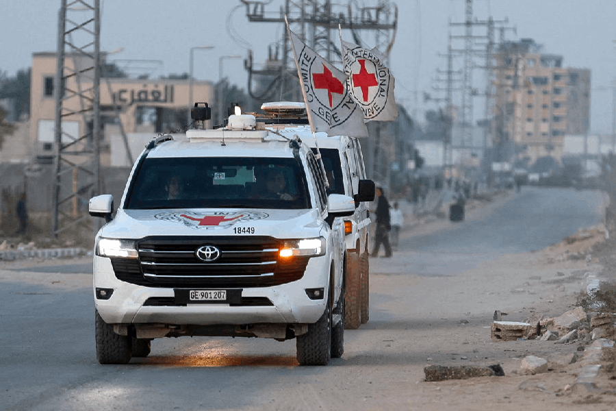 Red Cross transports the body of a deceased hostage, who had been held in Gaza since the deadly October 7, 2023, attack on Israel by Hamas, after it was handed over by Hamas militants as part of a ceasefire and a hostages-prisoners swap deal between Hamas and Israel, in Deir Al-Balah, in the central Gaza Strip, October 30, 2025.