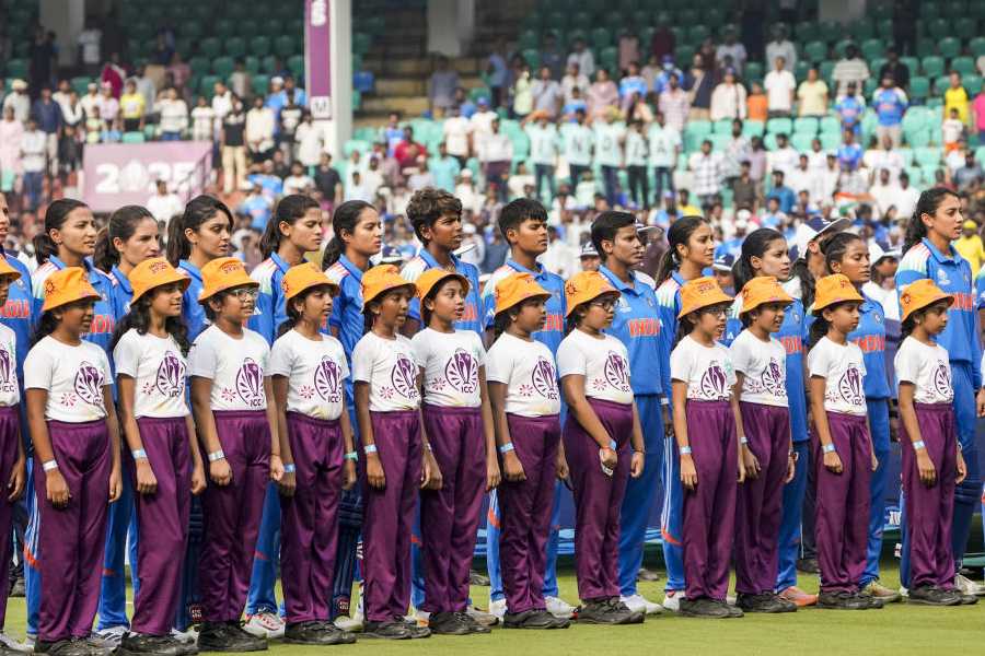 Indian players line up for the national anthem prior to the ICC Women's World Cup ODI cricket match between India Women and Australia Women, at the ACA-VDCA International Cricket Stadium, in Visakhapatnam, Andhra Pradesh, Sunday, Oct. 12, 2025