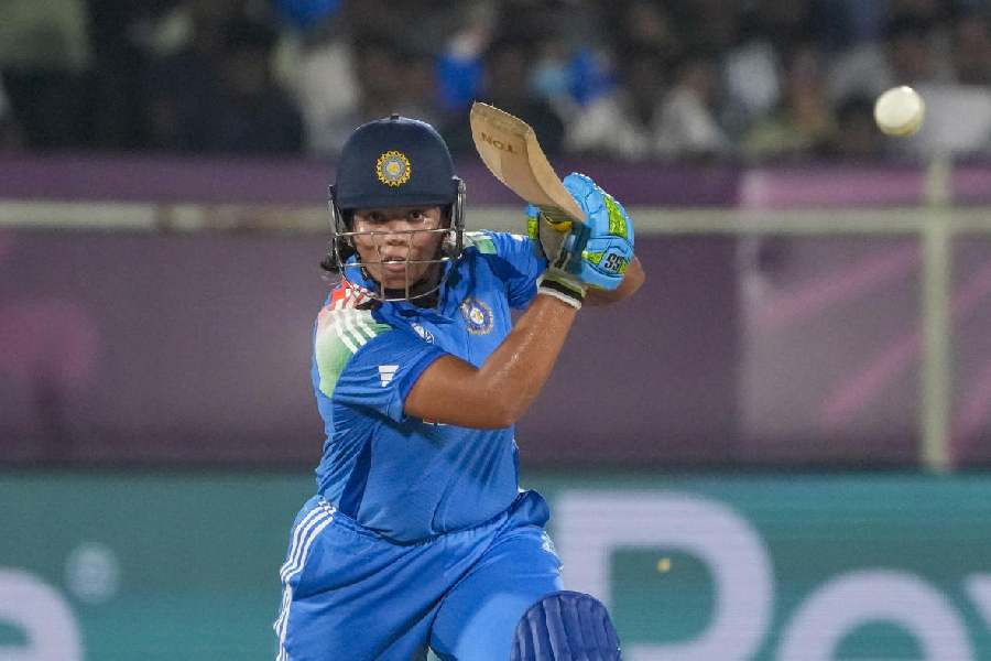 Richa Ghosh plays a shot during the ICC Women's World Cup ODI cricket match between India and South Africa at the ACA-VDCA International Cricket Stadium in Visakhapatnam on October 9
