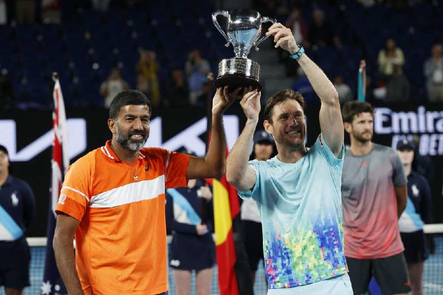 Rohan Bopanna (left) and Australia’s Matthew Ebden celebrate after winning the men’s doubles final at the Australian Open in Melbourne on January 27, 2024. They defeated Simone Bolelli and Andrea Vavassori 7-6 (7-0), 7-5 for the title. 