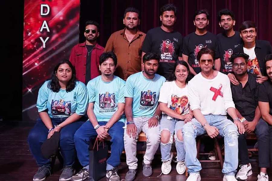 Satabdi Bhattacherjee (bottom left) with Shah Rukh Khan (second from right, bottom)