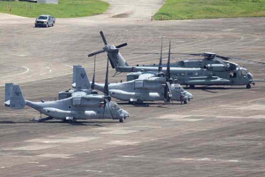U.S. Marine Corps and U.S. Air Force aircraft and helicopters are parked at the former Roosevelt Roads military base in Ceiba, Puerto Rico, September 30, 2025.