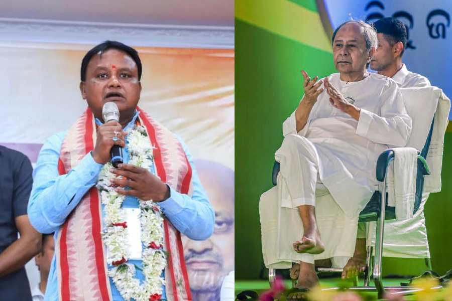 Mohan Charan Majhi and (right) Naveen Patnaik.