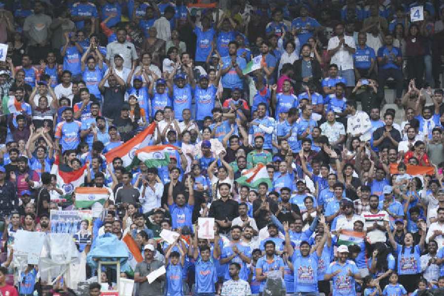 A sea of blue in theDY Patil Stadium stands cheer the team on.