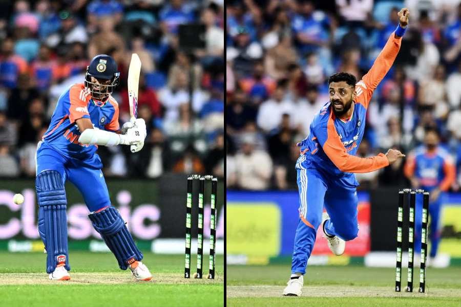 Washington Sundar and (right) Varun Chakravarthy in action at Bellerive Oval in Hobart on Sunday. 