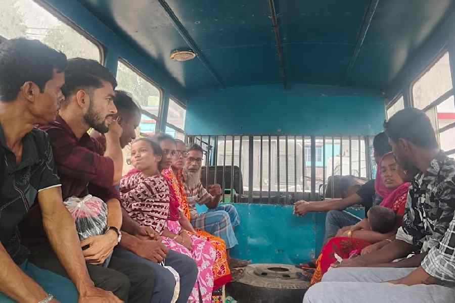 Arrested Bangladeshi nationals being taken to court from Swarupnagar police station in North 24-Parganas on Sunday.