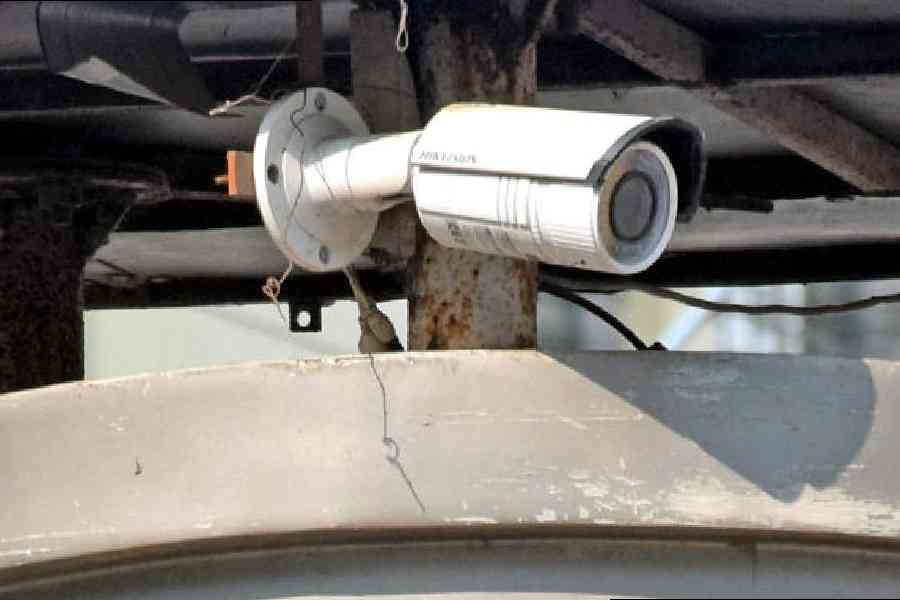 One of the CCTV cameras put up by the local civic body, which is currently defunct, at a locality in Balurghat town