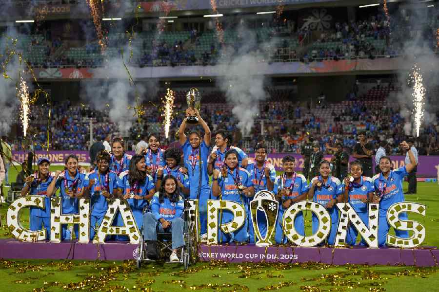 India’s players celebrate with the trophy during the presentation ceremony after winning the ICC Women's World Cup 2025, at the DY Patil Stadium, in Navi Mumbai, early Monday, Nov. 3, 2025.