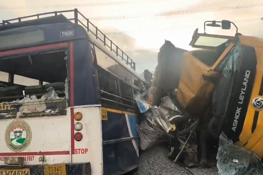 Mangled remains of a tipper lorry and a public transport bus after their collision, in Ranga Reddy district, Telangana, Monday, Nov. 3, 2025.