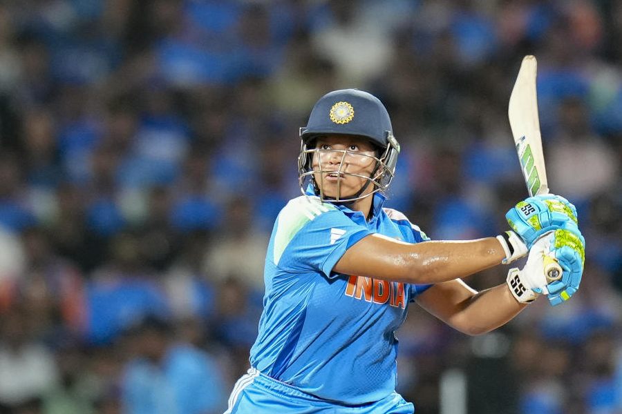 India's Richa Ghosh plays a shot during the ICC Women's World Cup final ODI cricket match between India Women and South Africa Women, at the DY Patil Stadium, in Navi Mumbai, Sunday, Nov. 2, 2025.